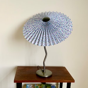 Vintage Ikea squiggle lamp with LeKrazyHorse, pleated tilting Eclipse lampshade, in blue floral fabric.