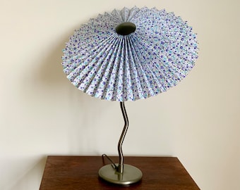 Vintage Ikea squiggle lamp with LeKrazyHorse, pleated tilting Eclipse lampshade, in blue floral fabric.