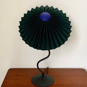 Clip on shade: Tilting Eclipse pleated lampshade in jungle green, with choice of finial. For table lamps, floor lamps or wall lights. Cobalt blue