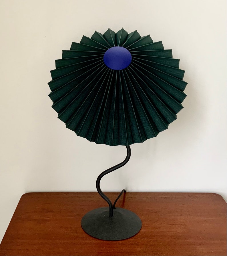 Clip on shade: Tilting Eclipse pleated lampshade in jungle green, with choice of finial. For table lamps, floor lamps or wall lights. Cobalt blue