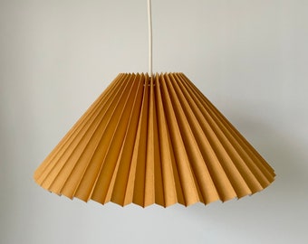 Hanging shade: Ochre linen MEDIUM EASTERN style pleated pendant / hanging shade, available in several sizes. Danish design.