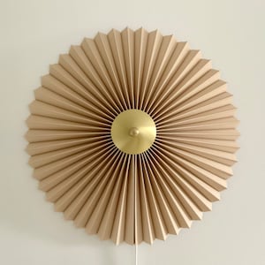 240V E14 Danish designed rosette wall light, choice of shade fabric and size/diameter. Solid brass centre finial. Cafe au lait linen