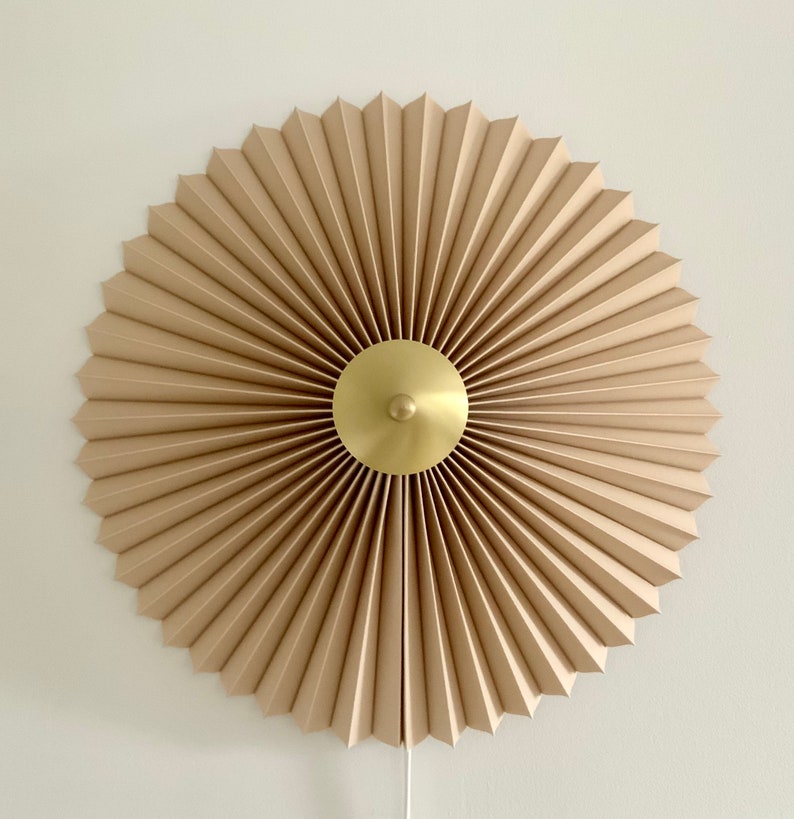 240V E14 Danish designed rosette wall light, choice of shade fabric and size/diameter. Solid brass centre finial. Cafe au lait linen
