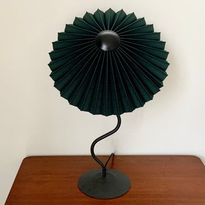 Clip on shade: Tilting Eclipse pleated lampshade in jungle green, with choice of finial. For table lamps, floor lamps or wall lights. Matt black