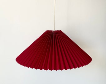 Hanging shade: Cardinal red linen, MEDIUM EASTERN style pleated pendant / shade, available in several sizes. Danish design.