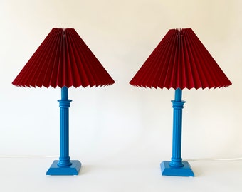 Pair of sky blue beech wood table lamps with Cardinal red pleated, linen lampshades. Vintage Danish.