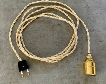 Plug in E27 base hanging cord kit, in solid brass or burnished brass, with wall and ceiling cable clamps.