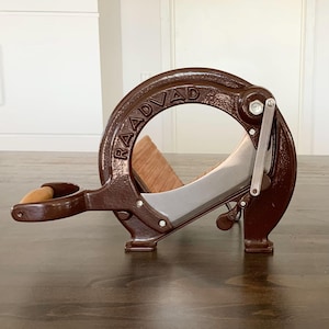 Chocolate brown vintage Danish Raadvad hard bread slicer  / vegetable cutter / cookbook holder.