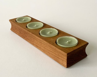 Solid oak candleholder for four tea candles, made by Trip Trap, Denmark.