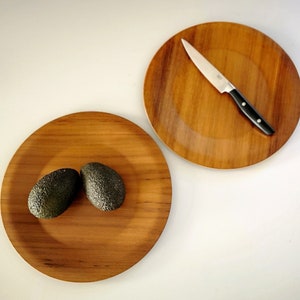 Pair of teak charger plates. Mid-century modernist design. Made in Denmark.