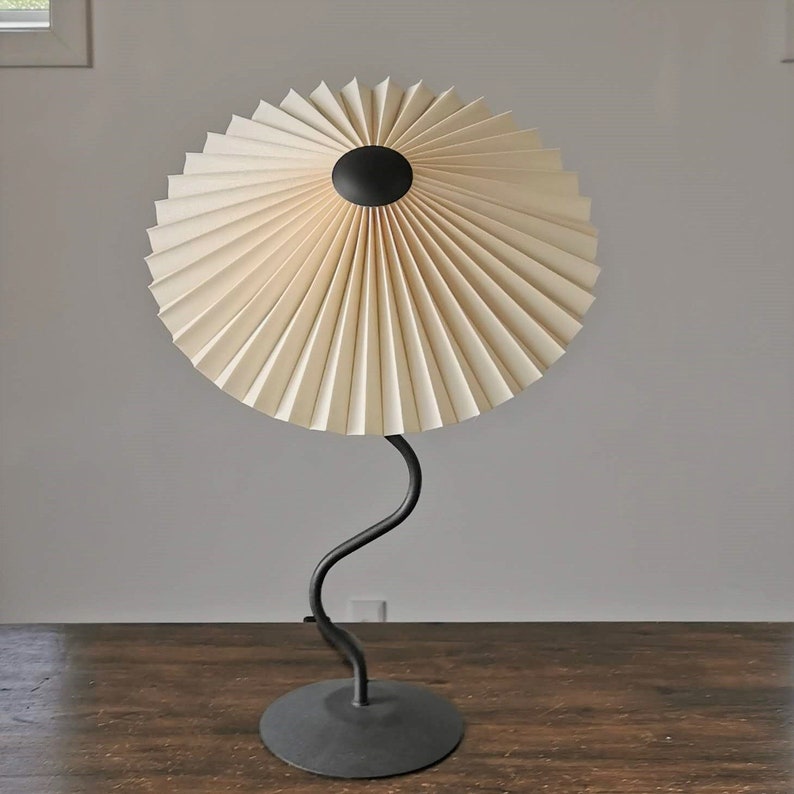 Clip on shade: Tilting Eclipse, pleated lampshade, available in several sizes, for table lamps, floor lamps or wall lights. Danish design. Cream linen