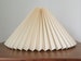 Clip on shade: Cream linen, pleated lampshade, available in two styles, for table lamps/wall lights. Danish designed. 