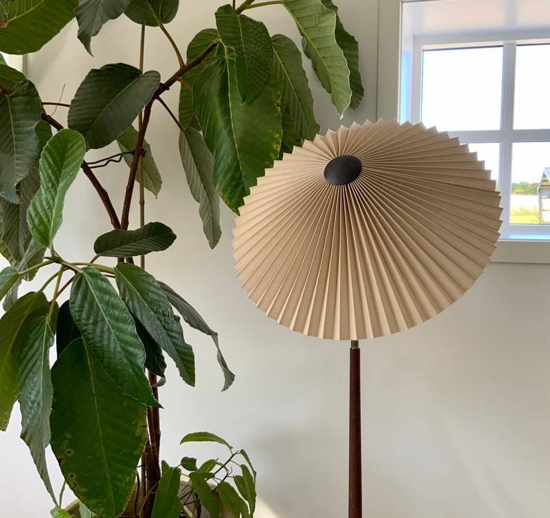 Clip on shade: Tilting Eclipse, pleated lampshade, available in several sizes, for table lamps, floor lamps or wall lights. Danish design. Cafe au lait linen