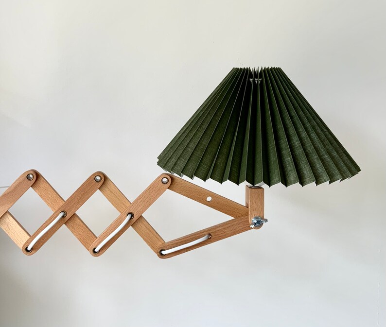 Danish designed beech wood accordion wall lamp with a new, Lekrazyhorse, pleated upper lampshade. Scandinavian retro interiors Olive green cotton