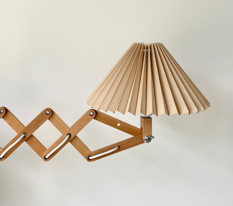 Danish designed beech wood accordion wall lamp with a new, Lekrazyhorse, pleated upper lampshade. Scandinavian retro interiors Cafe au lait linen