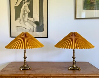 Pair of vintage Danish, solidbrass table lamps with ochre yellow pleated, linen lampshades.