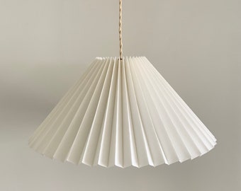 Hanging shade: White linen MEDIUM EASTERN style pleated pendant / hanging shade, available in several sizes. Danish design.