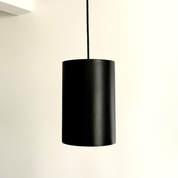 Black lacquered vintage Louis Poulsen cylinder pendant light, model 16512, designed by Eila & John Meiling.