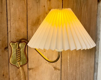 Vintage Danish brass swing arm wall lamp with a cream linen, knife pleated lampshade.