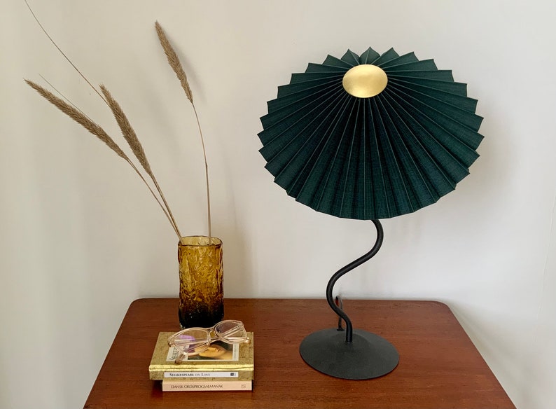 Clip on shade: Tilting Eclipse pleated lampshade in jungle green, with choice of finial. For table lamps, floor lamps or wall lights. Gold