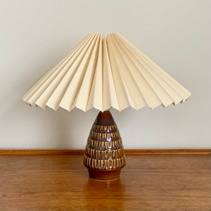 Danish Soholm, mid-century glazed ceramic / pottery table lamp with a cream linen, knife pleated lampshade. Wired for USA / Canada