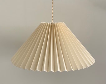 Hanging shade: Cream linen MEDIUM EASTERN style knife pleated pendant / hanging shade, available in several sizes. Danish design.