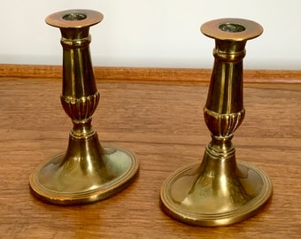 A pair of old English brass candle holders / sticks. Made in England.