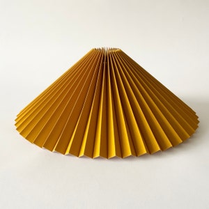 Clip on shade: Ochre yellow linen, pleated lampshade, available in two styles, for table lamps/wall lights. Danish designed.