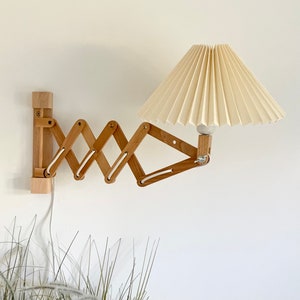 Danish designed beech wood accordion wall lamp with a new, Lekrazyhorse, pleated upper lampshade. Scandinavian retro interiors Cream linen