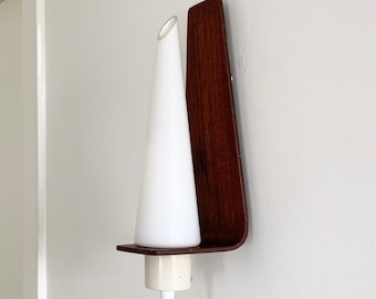 Mid-century modernist Danish teak wall light with opaque glass shade.