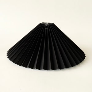Clip on shade: Black Ink chintz, pleated lampshade, available in two styles, for table lamps/wall lights. Danish design.