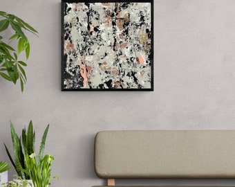 May include: Abstract art painting in shades of black, white, gray, and pink. The painting is framed in a black frame and is hanging on a gray wall.