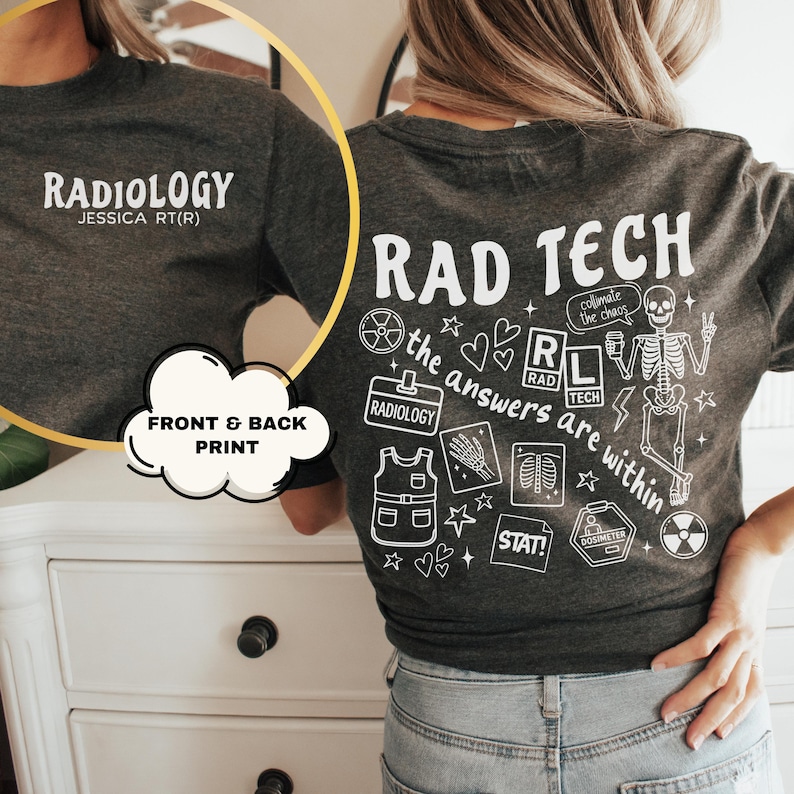 May include: Dark gray t-shirt with white text and graphics. The front says "RADIOLOGY" and "JESSICA RT(R)". The back features "RAD TECH" and medical-themed illustrations, including a skeleton and the phrase "the answers are within."
