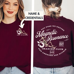 May include: Burgundy sweatshirt with a skeleton graphic and the text "You pose we expose Magnetic Resonance Est. 1977 The Imaging Club The answers are within MR" on the back. The front of the sweatshirt has a smaller skeleton graphic and the text "AMY RT(R)(MR)".