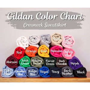 May include: Gildan Color Chart for Crewneck Sweatshirts. The chart shows 20 different color options, including white, ash, sport gray, sand, light pink, red, orange, gold, heliconia, safety pink, maroon, Irish green, military green, forest green, dark chocolate, purple, light blue, Carolina blue, indigo blue, royal blue, navy, dark heather, and black.