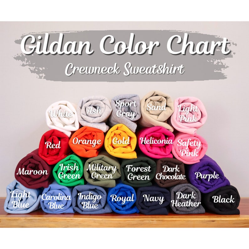 May include: Gildan Color Chart for Crewneck Sweatshirts. The chart shows 20 different color options, including white, ash, sport gray, sand, light pink, red, orange, gold, heliconia, safety pink, maroon, Irish green, military green, forest green, dark chocolate, purple, light blue, Carolina blue, indigo blue, royal blue, navy, dark heather, and black.
