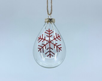 Teardrop glass Christmas ornament. Handmade red rhinestone snowflake design.