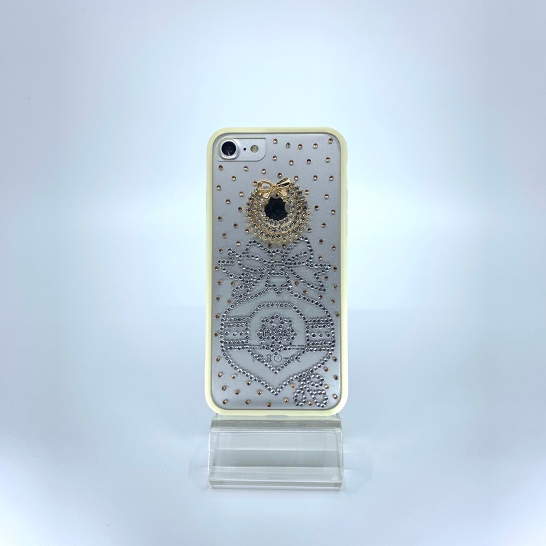 iPhone 7 or 8 TPU PC case. Unique Handmade. Silver rhinestone ornament bow design. Christmas wreath charm. White border Transparent Durable image 2