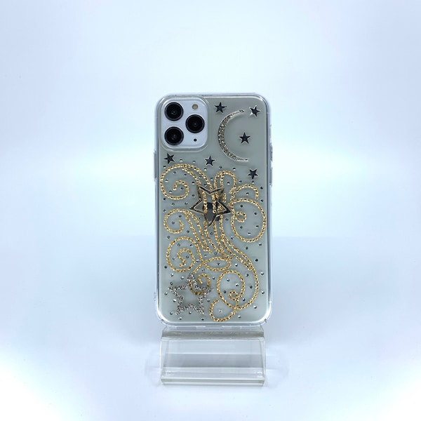 iPhone 11 Pro case. Protective PC material. Unique. Handmade. Gold and silver rhinestones. Swirls design. Stars and Crescent Moon charms.