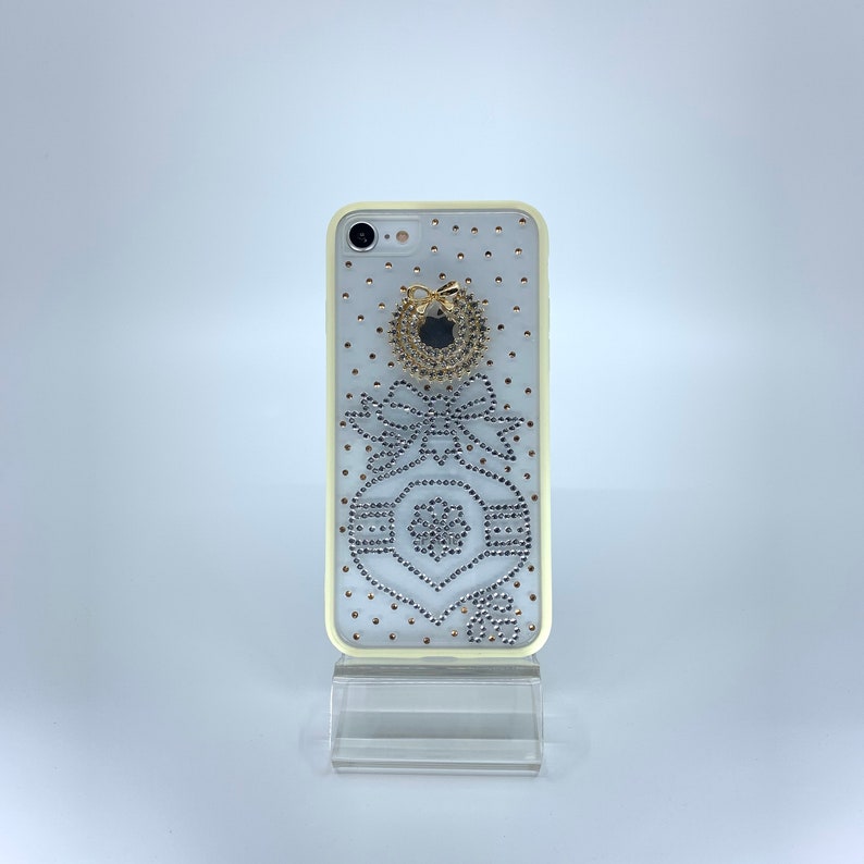 iPhone 7 or 8 TPU PC case. Unique Handmade. Silver rhinestone ornament bow design. Christmas wreath charm. White border Transparent Durable image 1