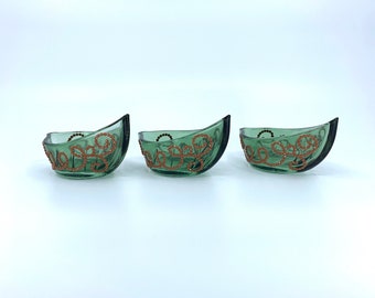 Set of 3 green candle holders. Holds tea candles. H - 1 in. & 2 in. / L - 4 in. / W - 2 in. Light brown Diamond Dotz stones in swirl design.