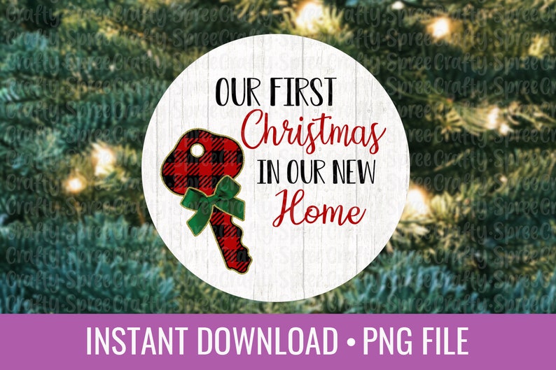 May include: A white circle with a woodgrain background featuring a red and black plaid key with a green bow. The text "OUR FIRST Christmas IN OUR NEW Home" is written in black and red.
