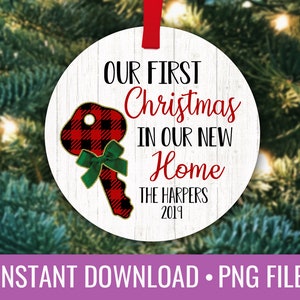 May include: A white round Christmas ornament with a red and black buffalo plaid key design. The ornament reads "Our First Christmas in Our New Home The Harpers 2019".