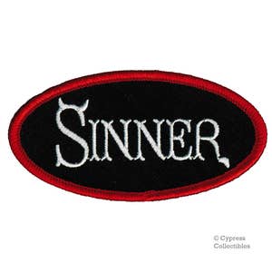 May include: Red oval-shaped patch with a black background and white embroidered text that reads "SINNER".