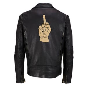May include: Black leather motorcycle jacket with a brown hand giving the middle finger on the back.