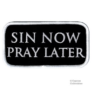 May include: Black and white embroidered patch with the text "Sin Now Pray Later" in white lettering.