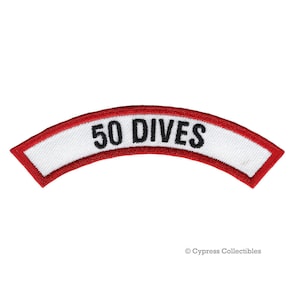 May include: White patch with a red border and the text "50 DIVES" in black.