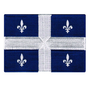May include: An embroidered patch featuring the flag of Quebec, Canada. The flag has a white cross on a blue background with four white fleurs-de-lis.