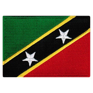 May include: A green, black, and red flag with two white five-pointed stars. The flag has a diagonal yellow stripe.