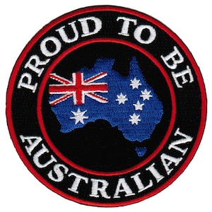 May include: A black and red circular patch with white text that reads "Proud to be Australian". The center of the patch features a blue outline of the continent of Australia with the Australian flag in the upper left corner.